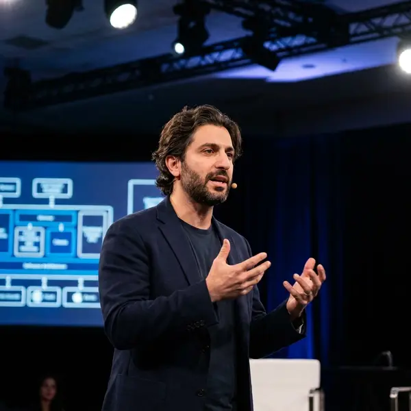 Generated image of Amir Khorasani at a conference
