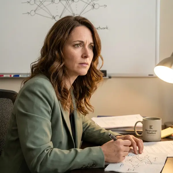 Generated image of Dr. Elise Fontaine at their desk
