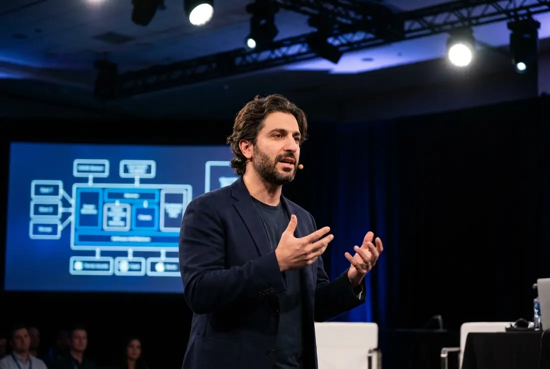 Generated image of Amir Khorasani presenting at a conference