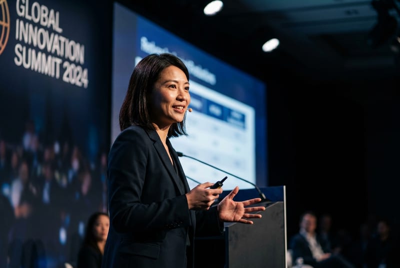Maya Chen presenting at a design conference